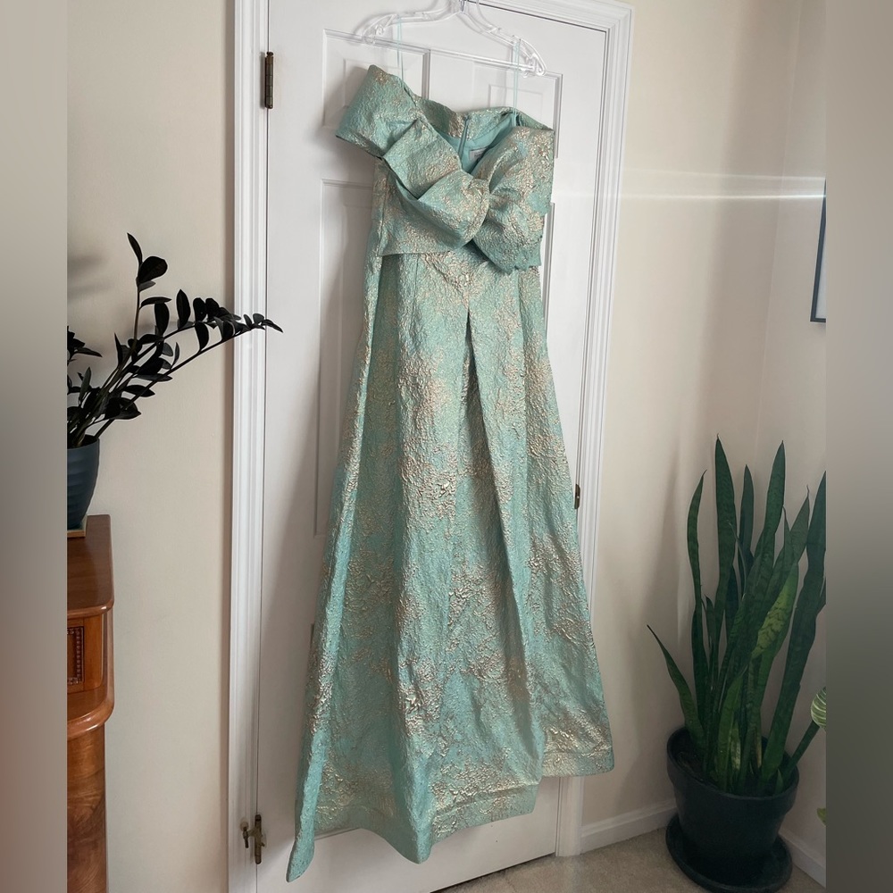 Teri Jon by Rickie Freeman Metallic Bow Portrait A-Line Gown in Mint Gold